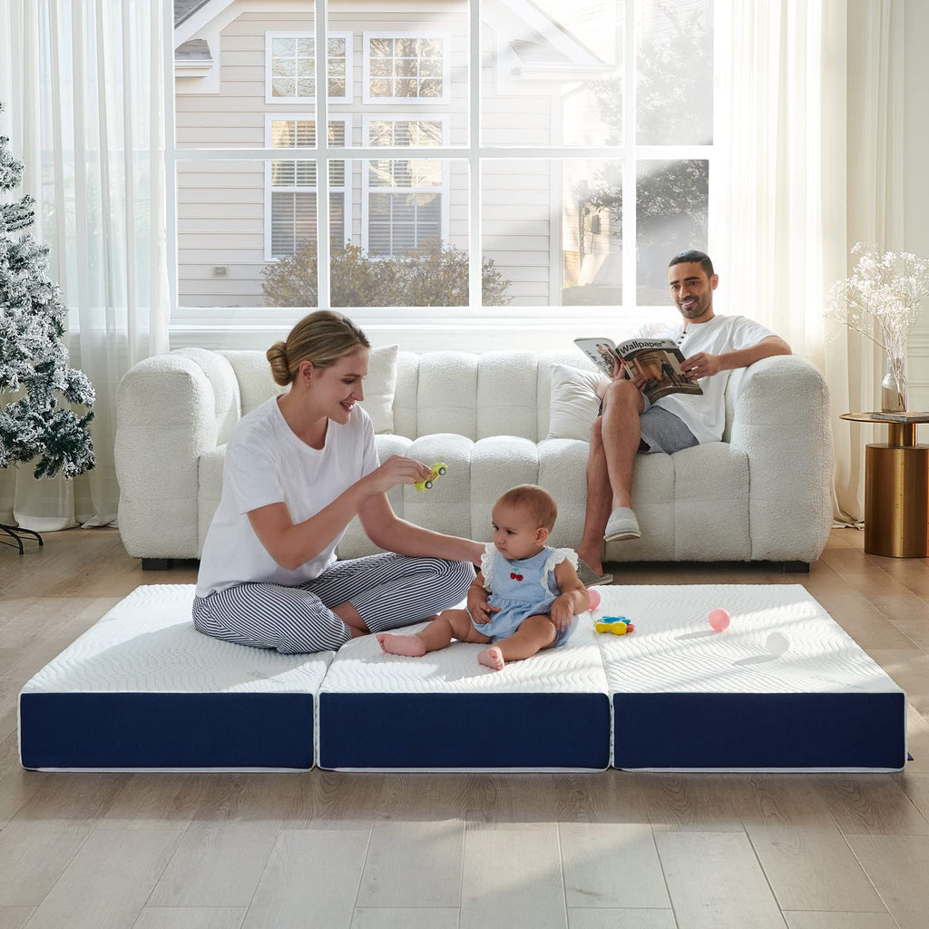 A family lies comfortably on the compact tri folding memory foam mattress